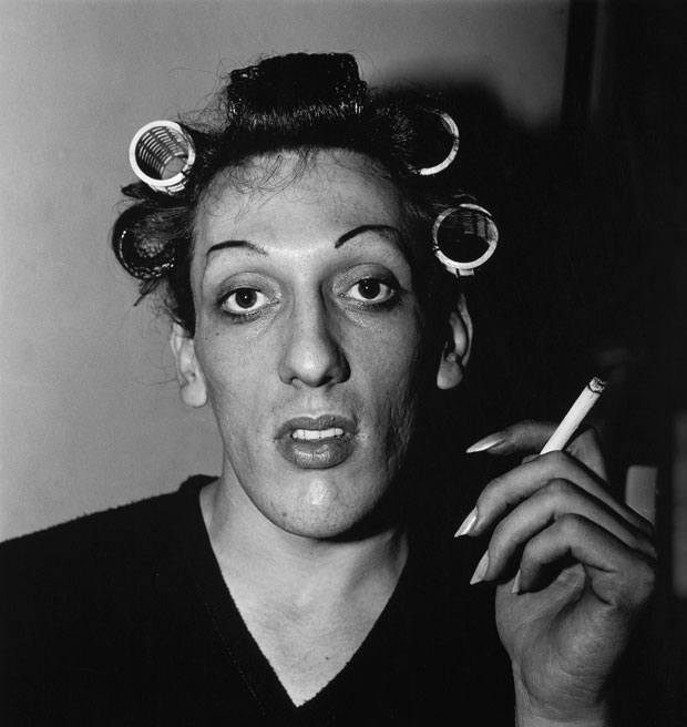 A-young-man-with-curlers-at-home-on-West-20th-Street,-N.Y.C.