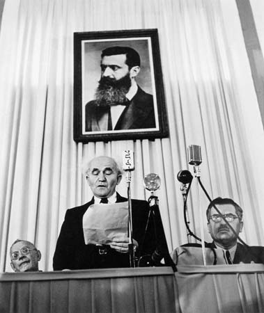 ISRAEL.-Tel-Aviv.-May-14th,-1948.-Founder-of-the-state-of-Israel,-David-Ben-Gurion-reads-the-proclamation-that-will-establish-Israel-as-an-independent-nation.